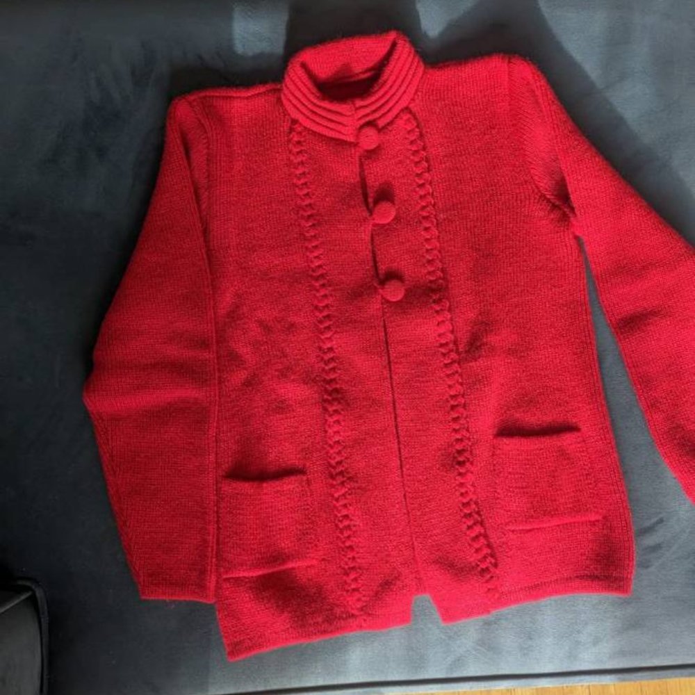 In excellent condition, never worn red sweater
